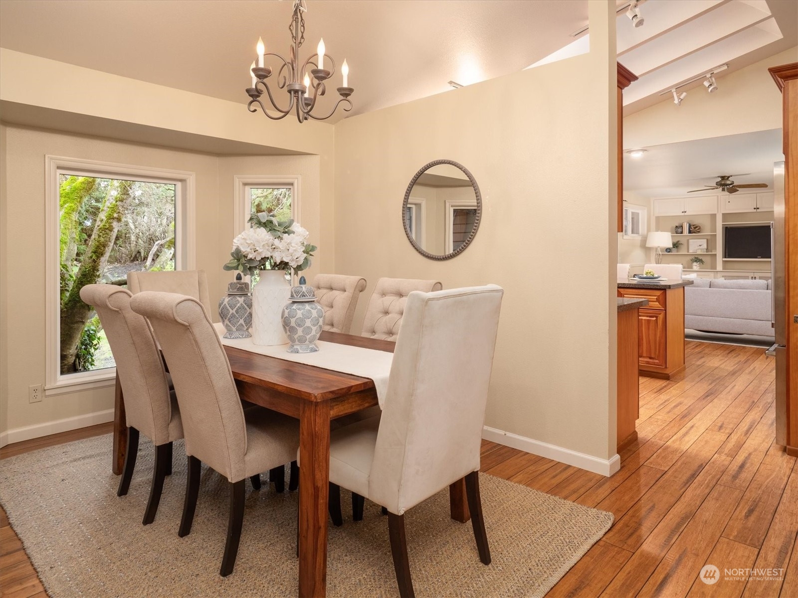 1622 243rd Place Southeast Bothell, WA 98021 - Photo 8 of 25 a view of a dining room with furniture window and wooden floor
