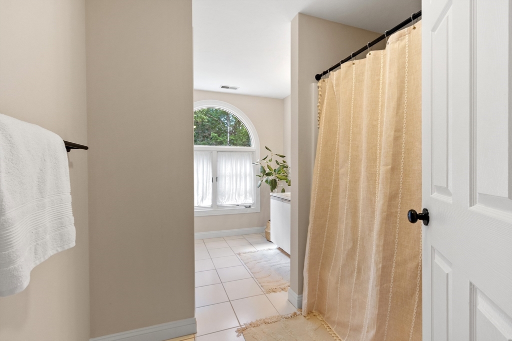 44 Woobly Road Bolton, MA 01740 - Photo 20 of 31 a bathroom with a shower curtain