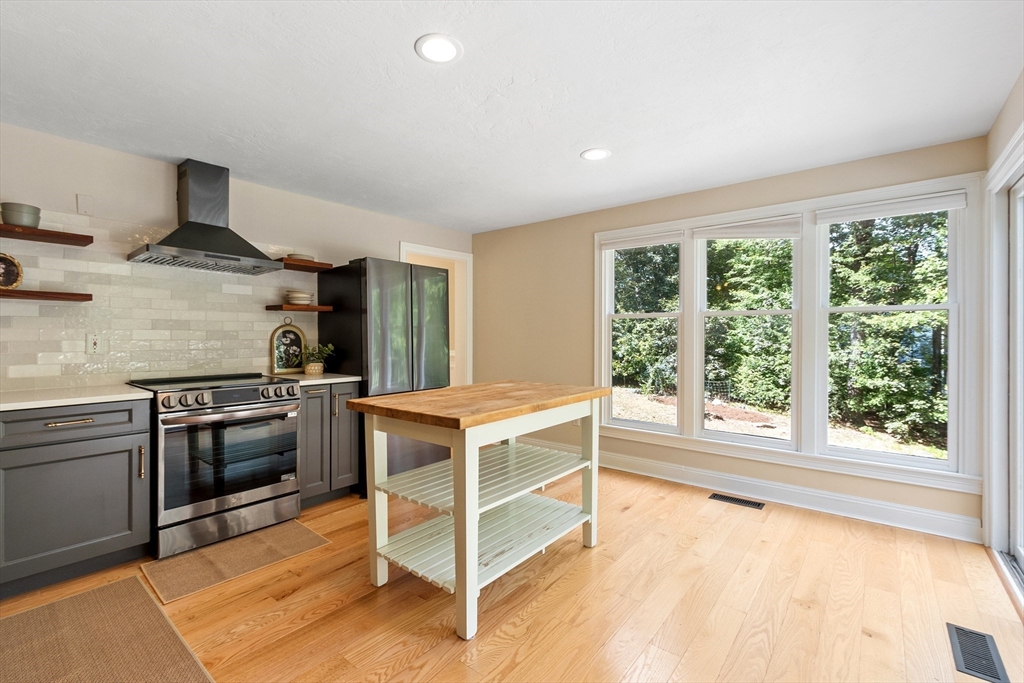 44 Woobly Road Bolton, MA 01740 - Photo 6 of 31 a kitchen with a stove a sink and a refrigerator