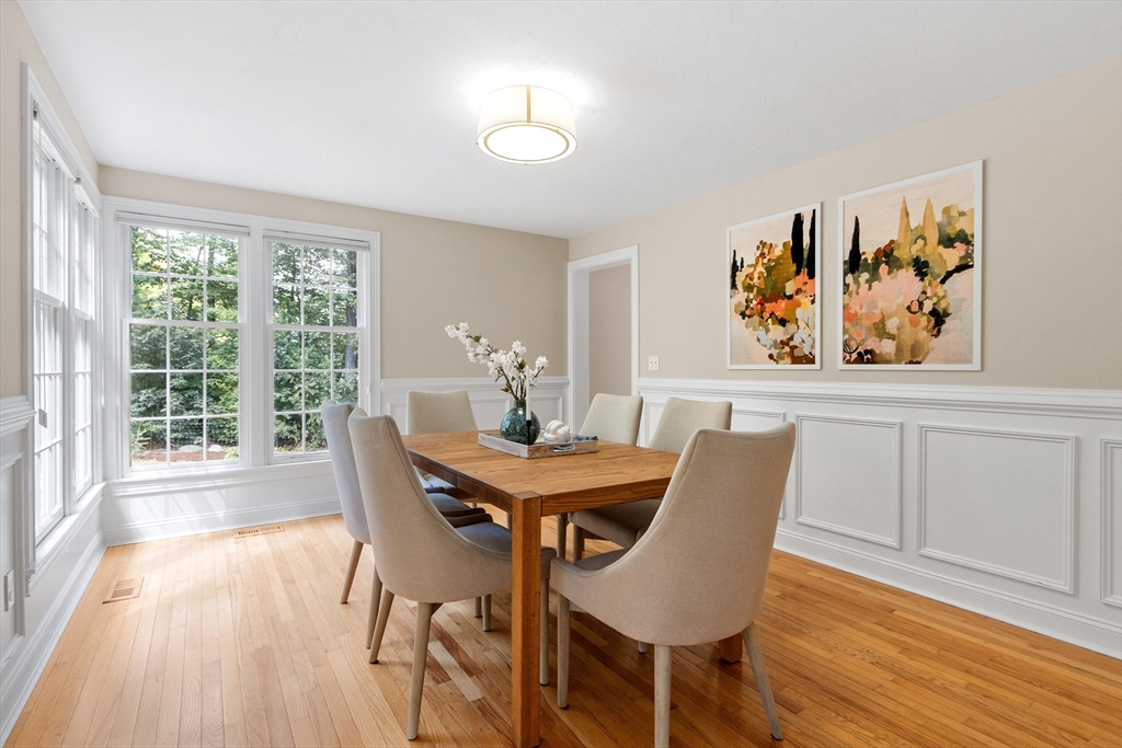 44 Woobly Road Bolton, MA 01740 - Photo 8 of 31 a view of a dining room with furniture a chandelier and wooden floor