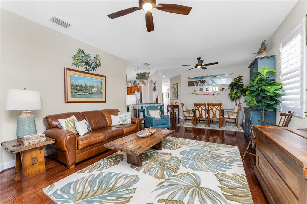 17094 Acapulco Road, Unit 321 Punta Gorda, FL 33955 - Photo 12 of 52 a living room with furniture and a potted plant