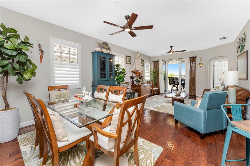 17094 Acapulco Road, Unit 321 Punta Gorda, FL 33955 - Photo 15 of 52 a living room with furniture a ceiling fan and a potted plant