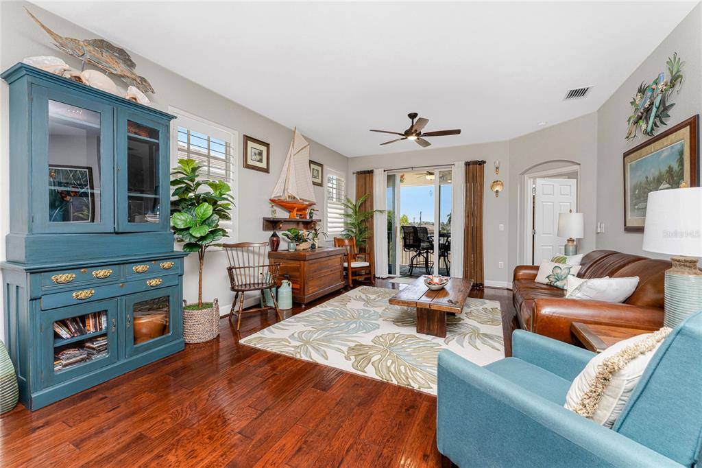 17094 Acapulco Road, Unit 321 Punta Gorda, FL 33955 - Photo 16 of 52 a living room with furniture and wooden floor