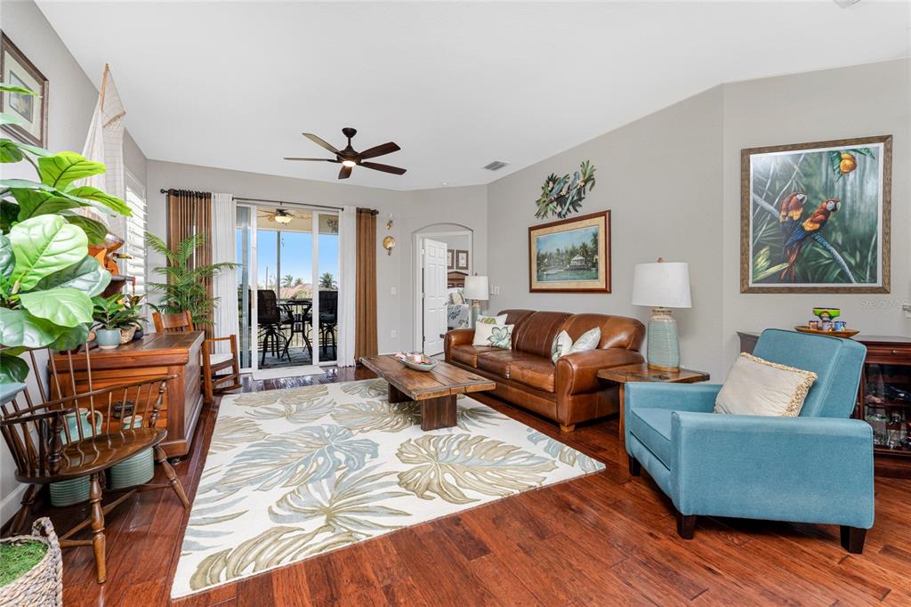 17094 Acapulco Road, Unit 321 Punta Gorda, FL 33955 - Photo 17 of 52 a living room with furniture dining area and a chandelier