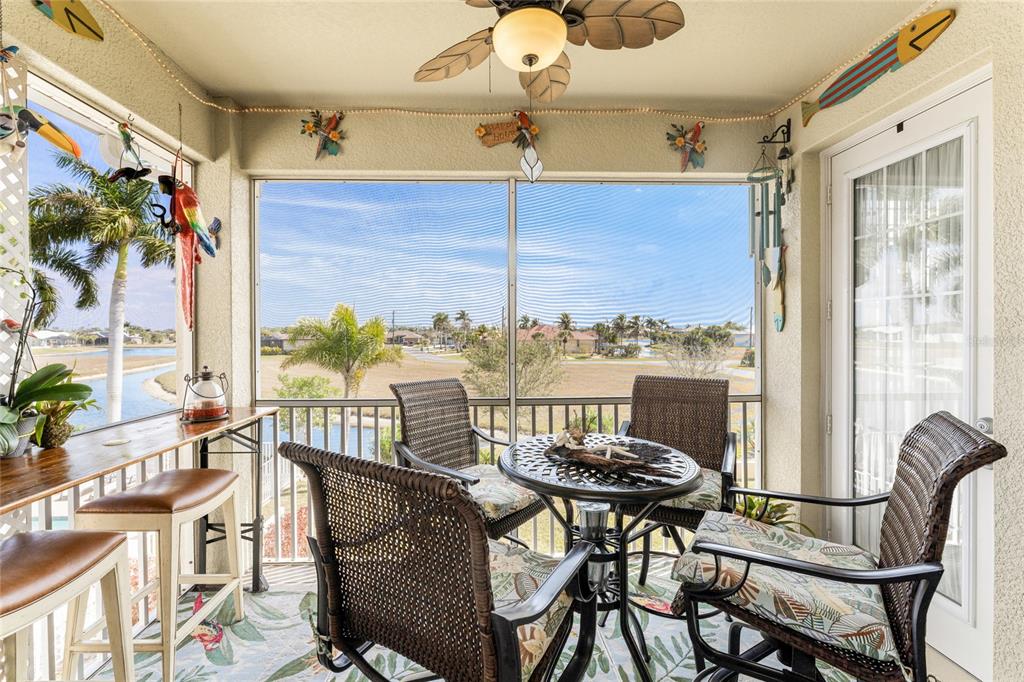17094 Acapulco Road, Unit 321 Punta Gorda, FL 33955 - Photo 18 of 52 a view of a dining room with furniture window and outside view