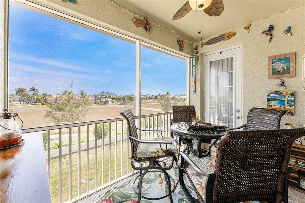 17094 Acapulco Road, Unit 321 Punta Gorda, FL 33955 - Photo 19 of 52 a view of a balcony with chairs