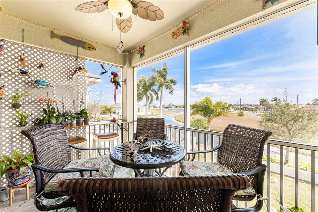 17094 Acapulco Road, Unit 321 Punta Gorda, FL 33955 - Photo 20 of 52 a view of a chairs and table in patio