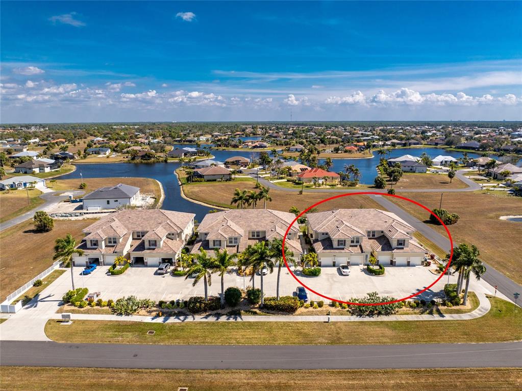 17094 Acapulco Road, Unit 321 Punta Gorda, FL 33955 - Photo 2 of 52 a view of a swimming pool with an ocean view