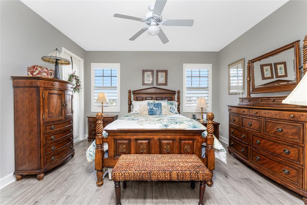 17094 Acapulco Road, Unit 321 Punta Gorda, FL 33955 - Photo 21 of 52 a bedroom with a bed and wooden floor