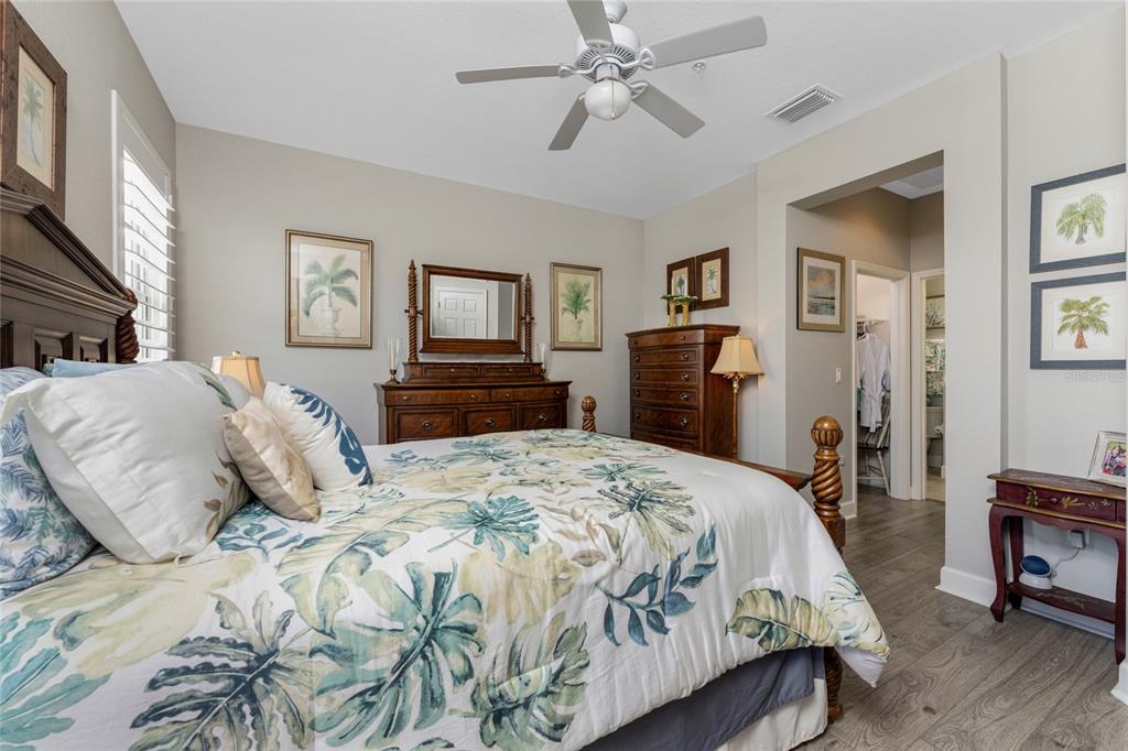 17094 Acapulco Road, Unit 321 Punta Gorda, FL 33955 - Photo 24 of 52 a bedroom with a bed and wooden floor