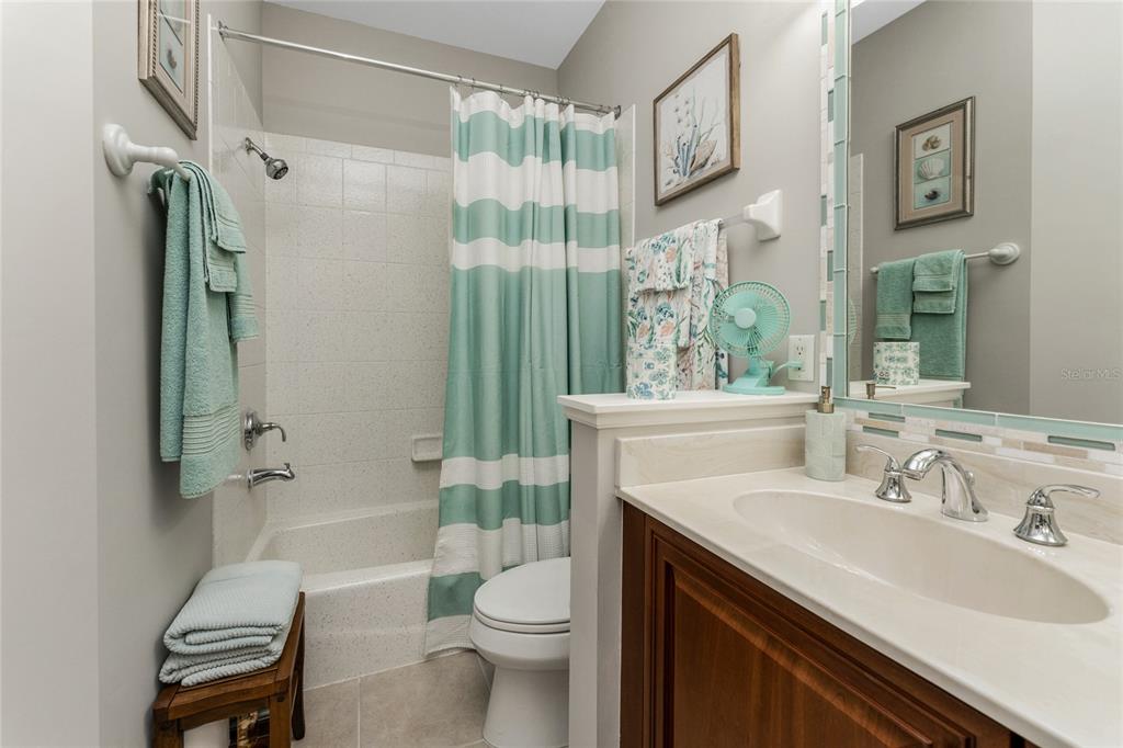 17094 Acapulco Road, Unit 321 Punta Gorda, FL 33955 - Photo 26 of 52 a bathroom with a sink toilet tub and shower