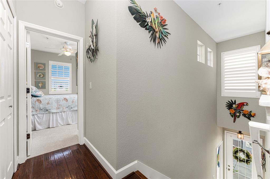 17094 Acapulco Road, Unit 321 Punta Gorda, FL 33955 - Photo 32 of 52 a view of hallway with livingroom and wooden floor