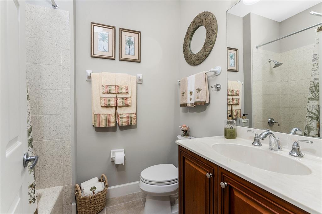 17094 Acapulco Road, Unit 321 Punta Gorda, FL 33955 - Photo 36 of 52 a bathroom with a toilet a sink and a mirror