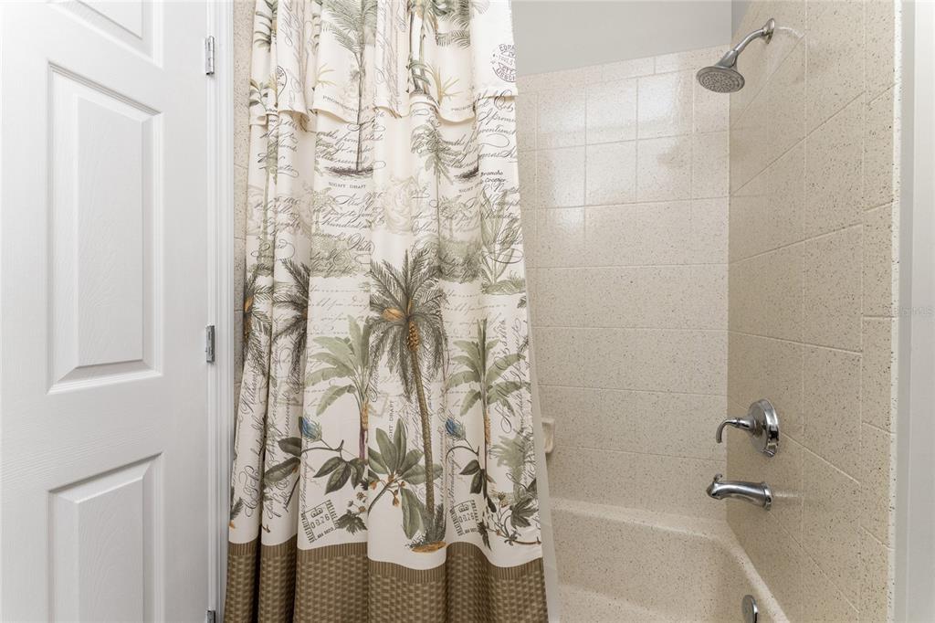 17094 Acapulco Road, Unit 321 Punta Gorda, FL 33955 - Photo 37 of 52 a bathroom with a shower curtain