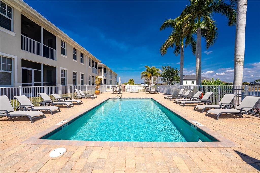 17094 Acapulco Road, Unit 321 Punta Gorda, FL 33955 - Photo 42 of 52 a view of swimming pool with outdoor seating and a patio