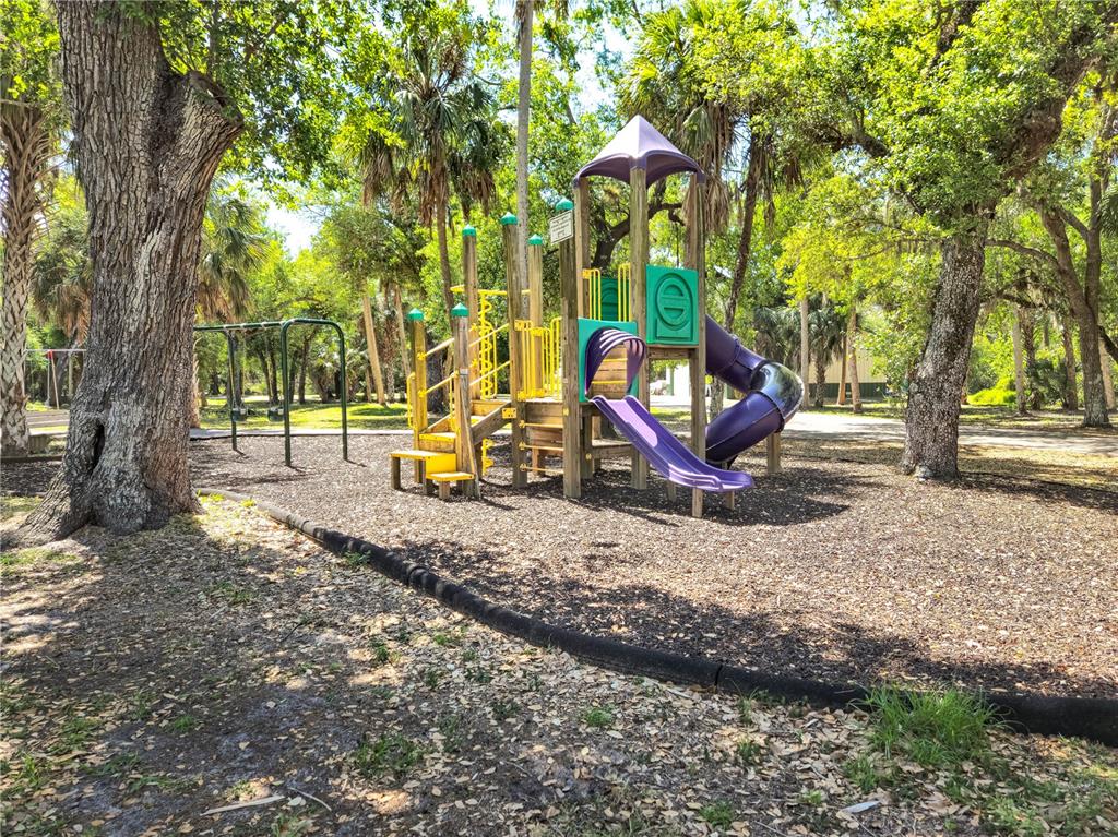 17094 Acapulco Road, Unit 321 Punta Gorda, FL 33955 - Photo 50 of 52 a view of a park with large trees