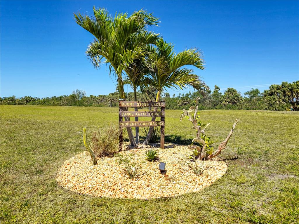 17094 Acapulco Road, Unit 321 Punta Gorda, FL 33955 - Photo 52 of 52 a view of a lake with houses in the back