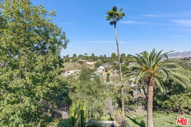 a bathroom with a sink vanity mirror bathtub shower and toilet