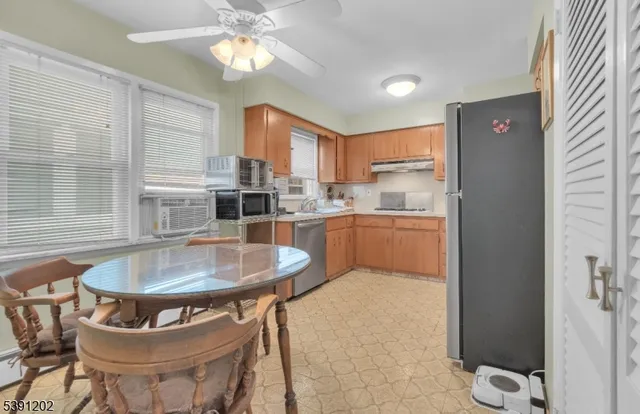 a kitchen with table and chairs