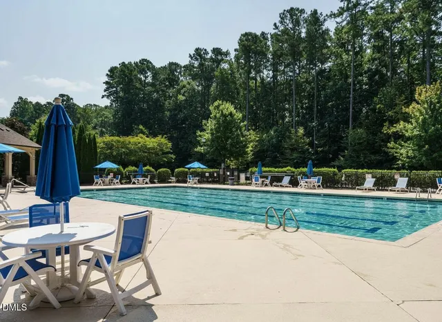 a view of a backyard with sitting area