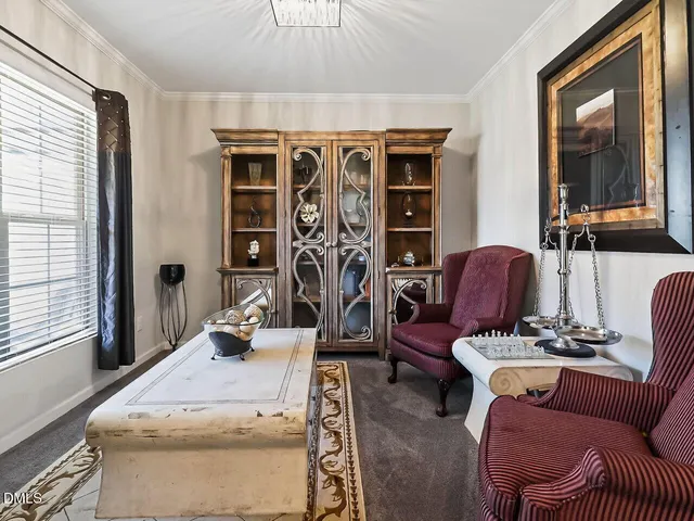 a view of a livingroom with furniture and window