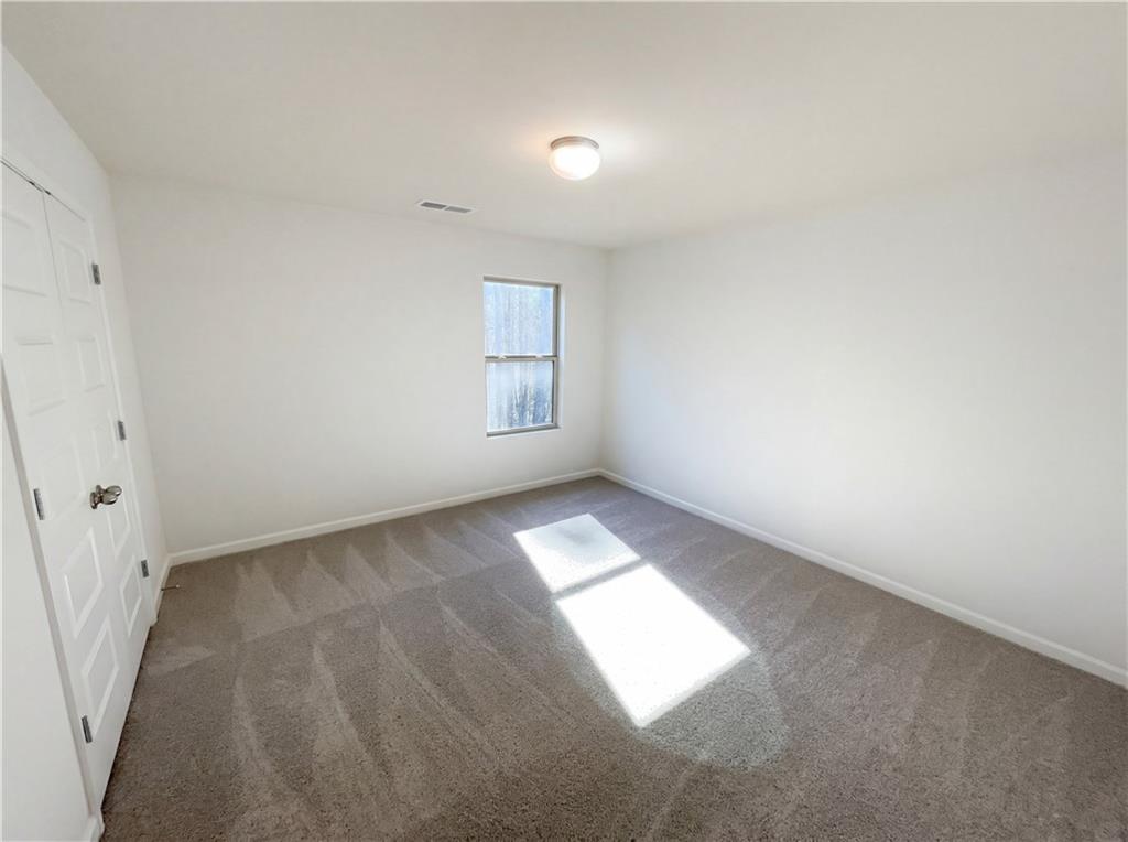 1209 Vienna Court Hampton, GA 30228 - Photo 14 of 21 an empty room with windows