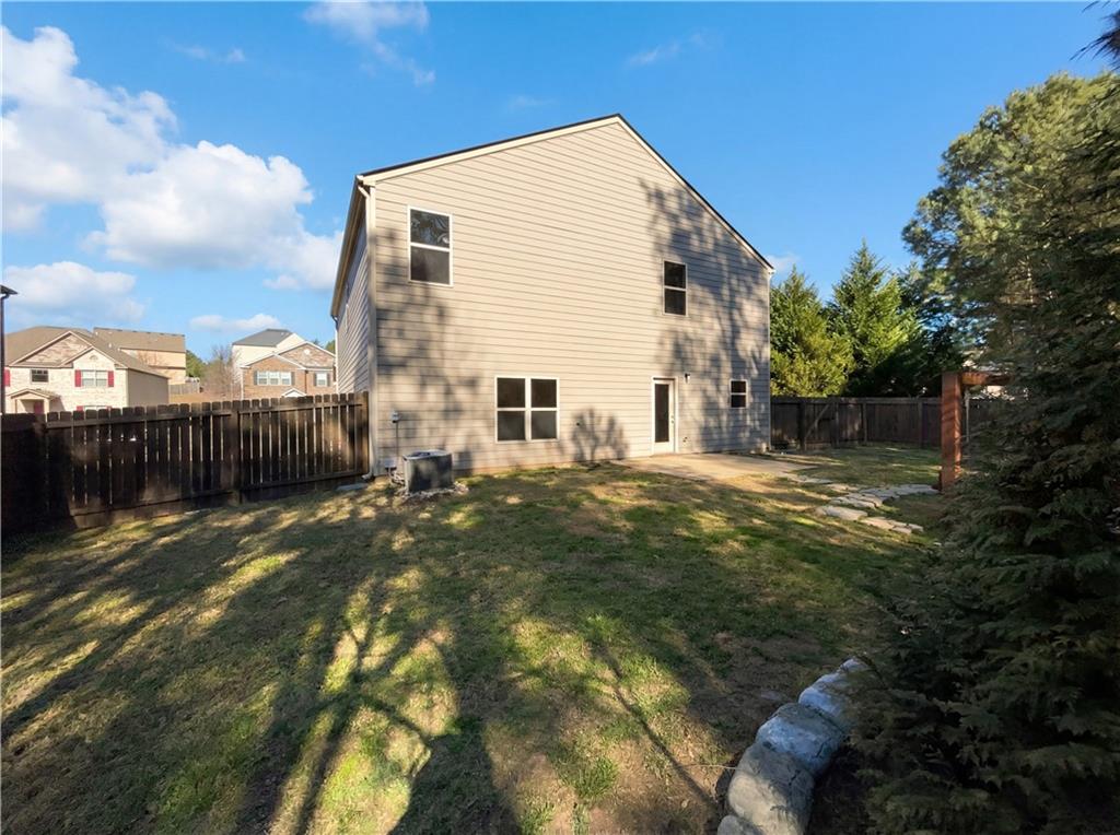 1209 Vienna Court Hampton, GA 30228 - Photo 5 of 21 a backyard of a house
