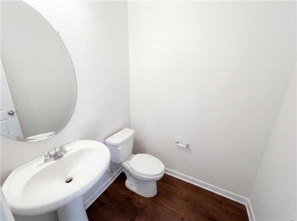 1209 Vienna Court Hampton, GA 30228 - Photo 10 of 21 a bathroom with a sink and a mirror