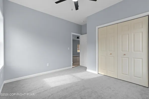 a view of an empty room and window