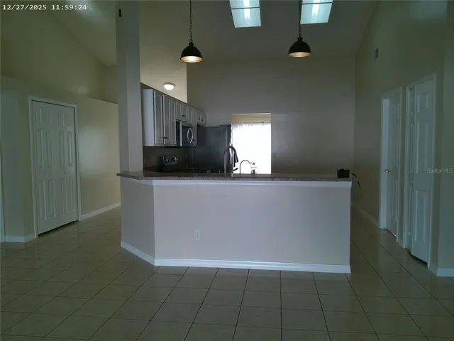 a view of a kitchen with a sink