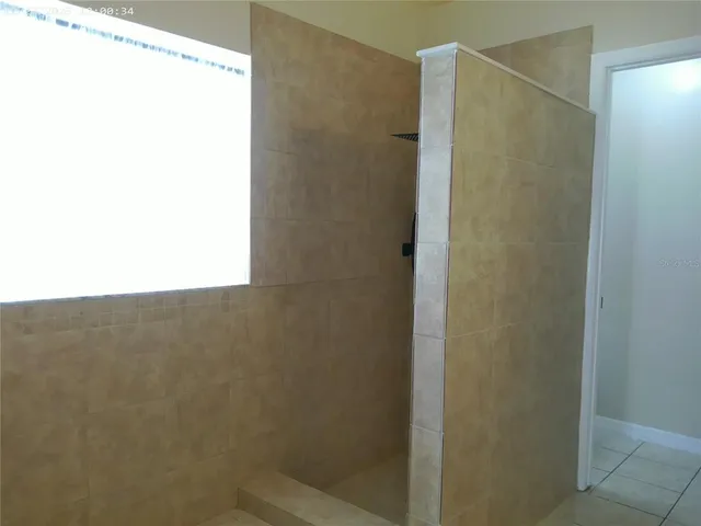 a bathroom with a shower and a toilet