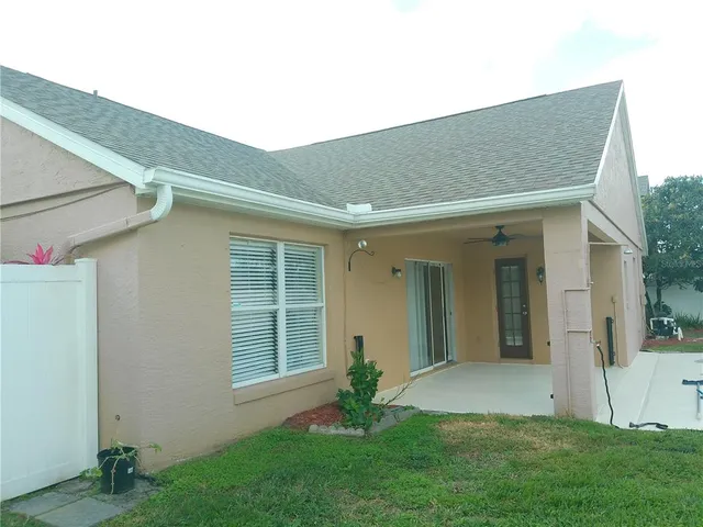 a backyard of a house with seating space