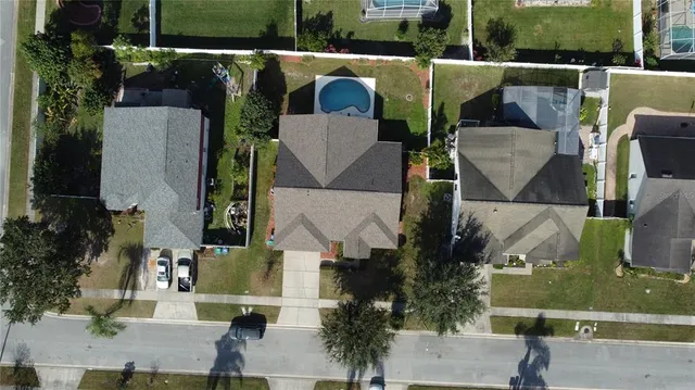 an aerial view of houses with outdoor space
