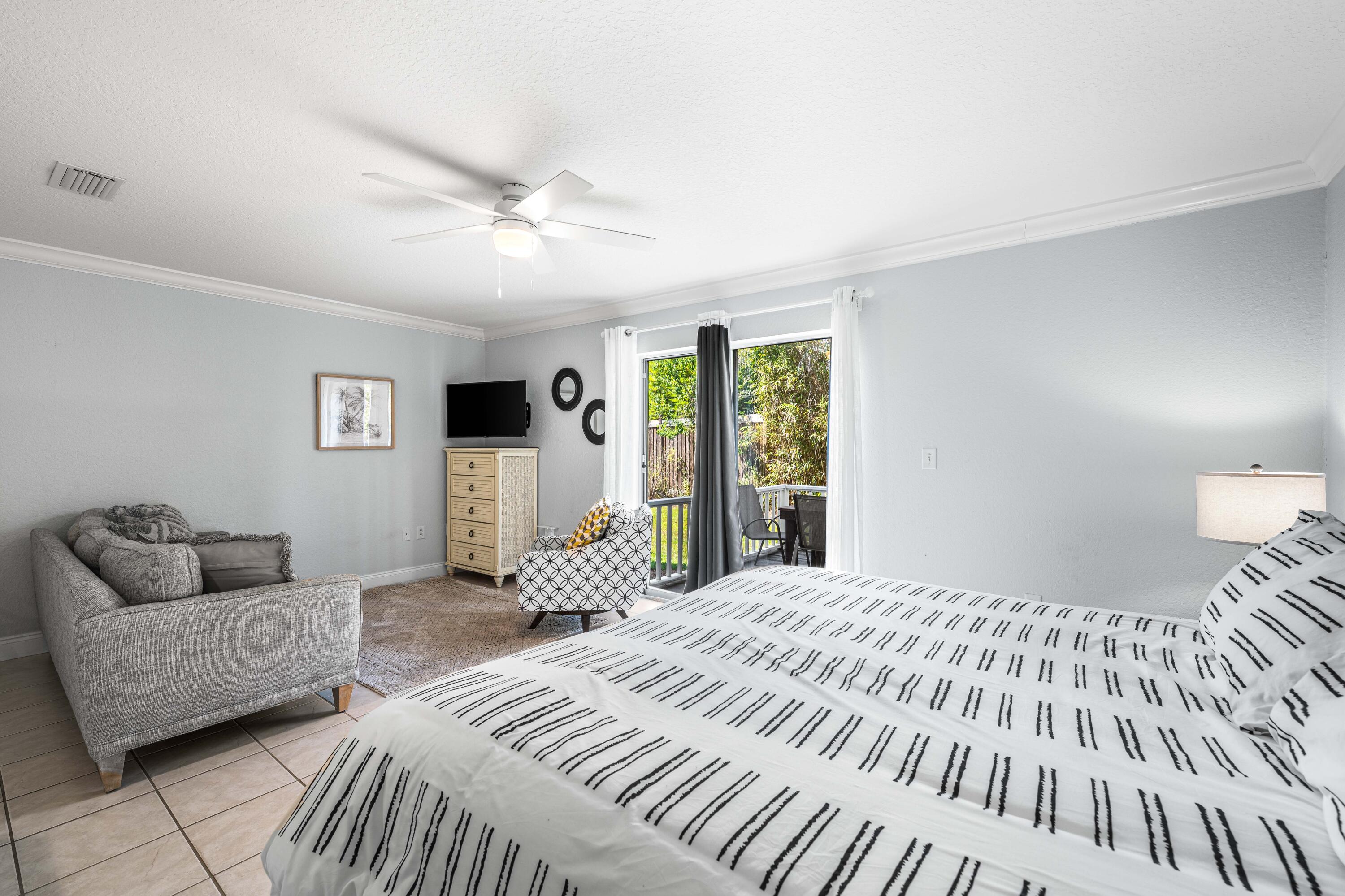 33 Dune Breeze Lane, Unit H2 Santa Rosa Beach, FL 32459 - Photo 41 of 54 a bedroom with a large bed and a couch