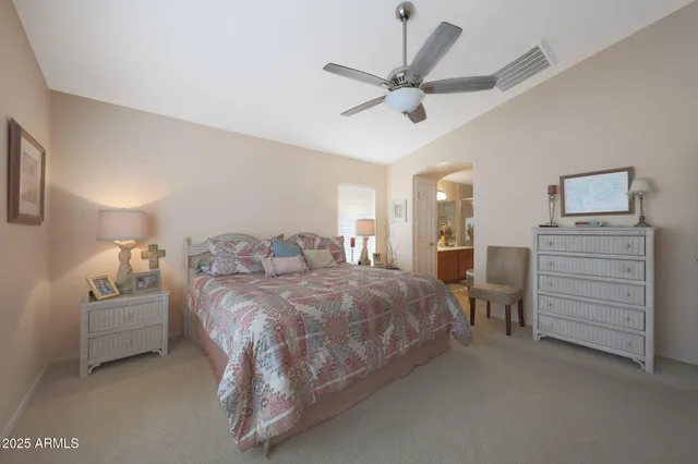 a spacious bedroom with a bed and closet