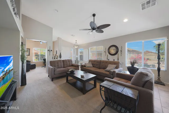 a living room with furniture and a large window