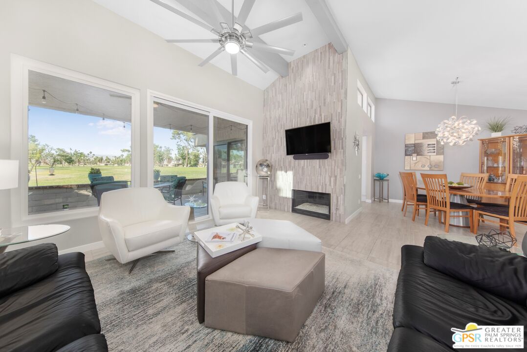 36022 Paseo Circulo West Cathedral City, CA 92234 - Photo 11 of 47 a living room with furniture a fireplace and a flat screen tv