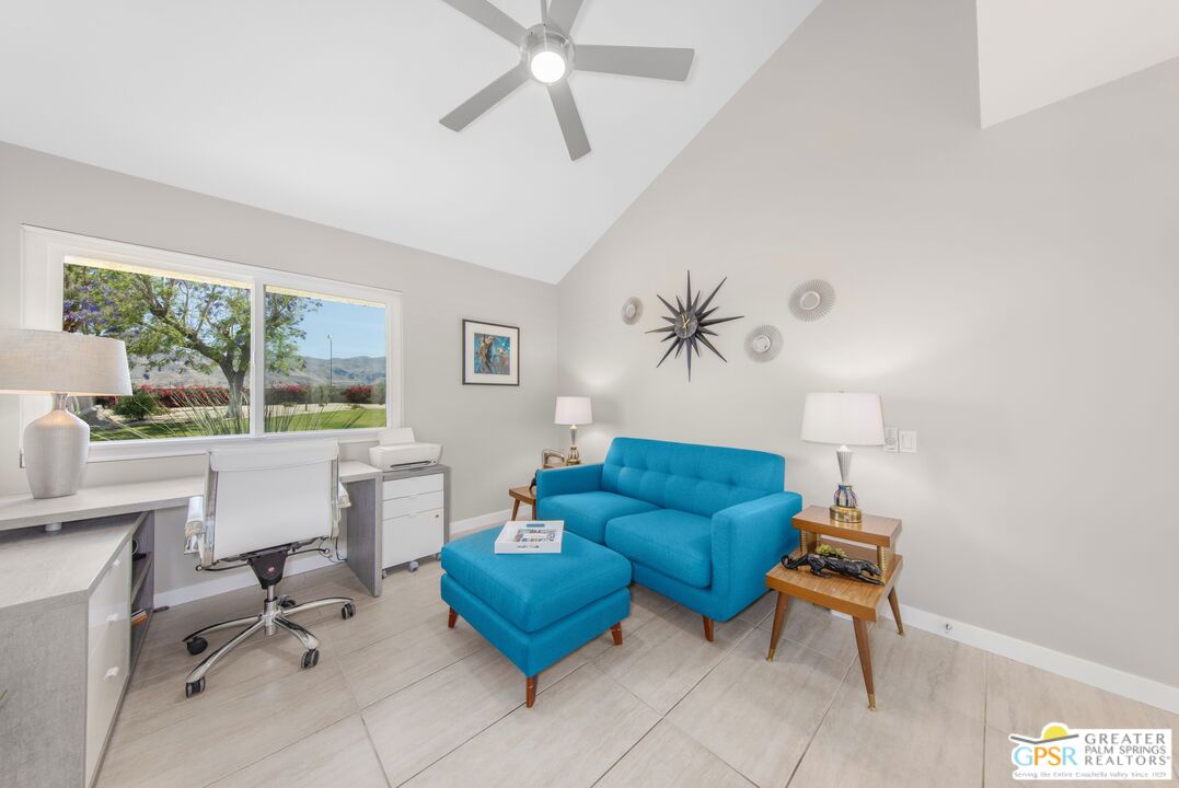 36022 Paseo Circulo West Cathedral City, CA 92234 - Photo 23 of 47 a living room with furniture a table and a large window