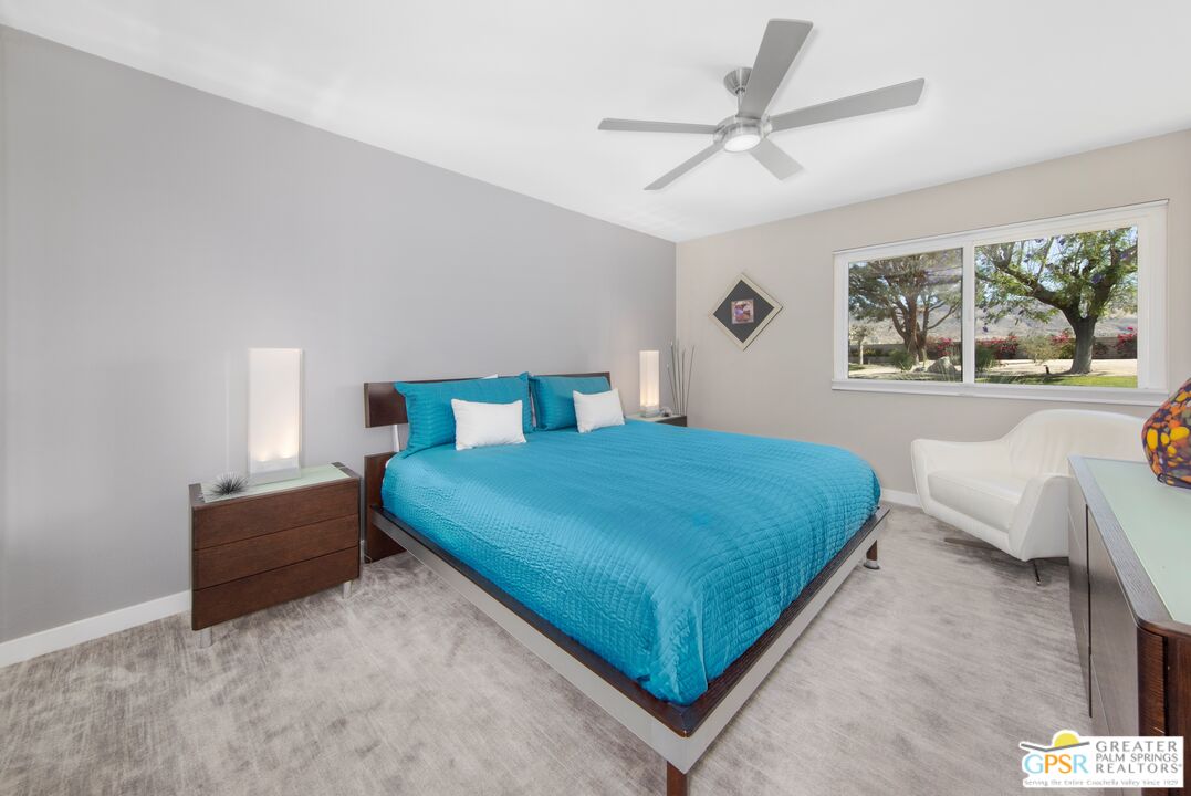 36022 Paseo Circulo West Cathedral City, CA 92234 - Photo 27 of 47 a bedroom with a bed mirror and window