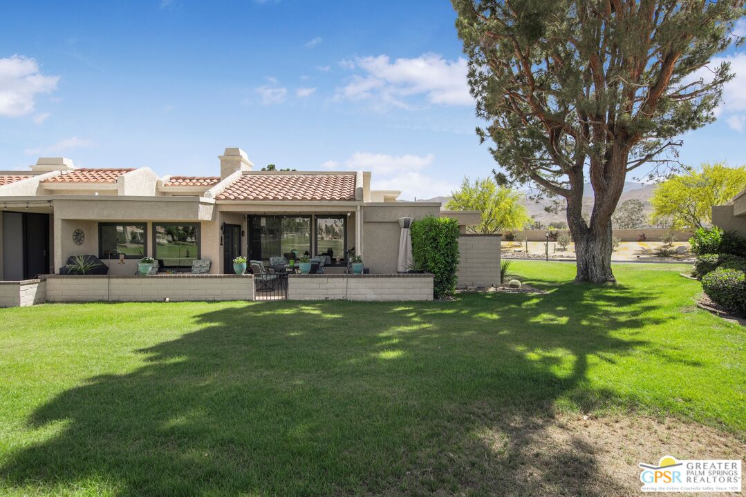 36022 Paseo Circulo West Cathedral City, CA 92234 - Photo 3 of 47 a view of a house with a yard porch and sitting area