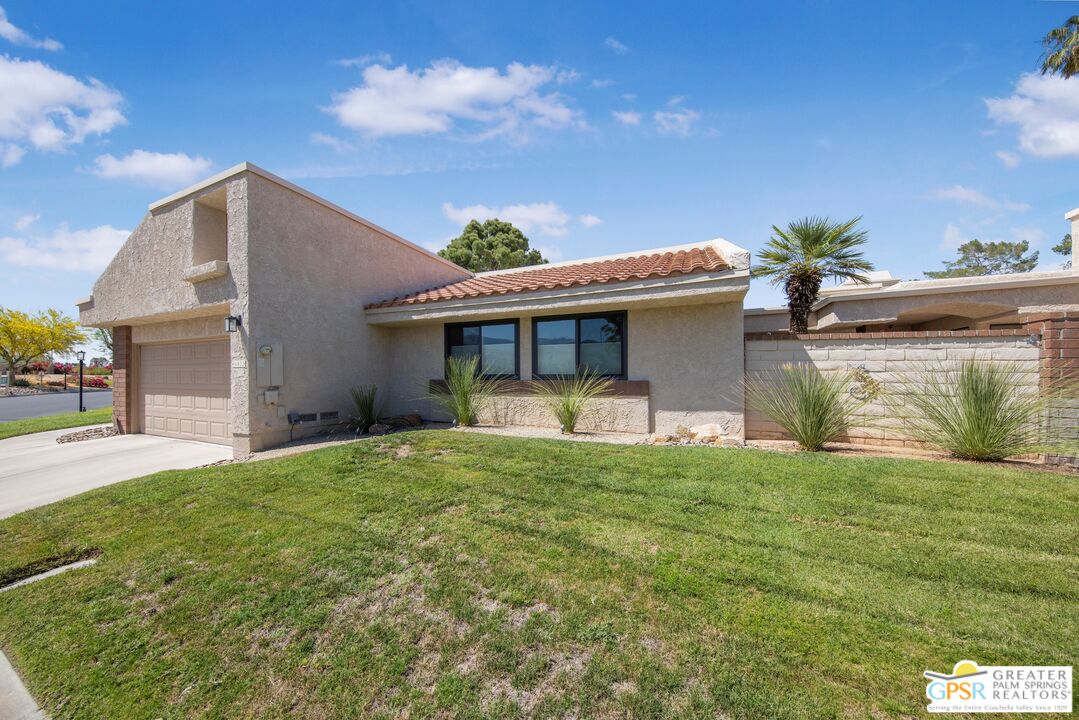 36022 Paseo Circulo West Cathedral City, CA 92234 - Photo 39 of 47 a view of a house with a yard and garage