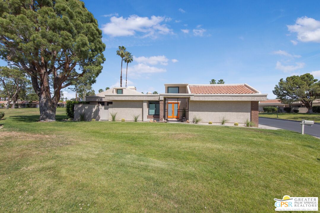 36022 Paseo Circulo West Cathedral City, CA 92234 - Photo 40 of 47 a view of a house with a big yard and large trees