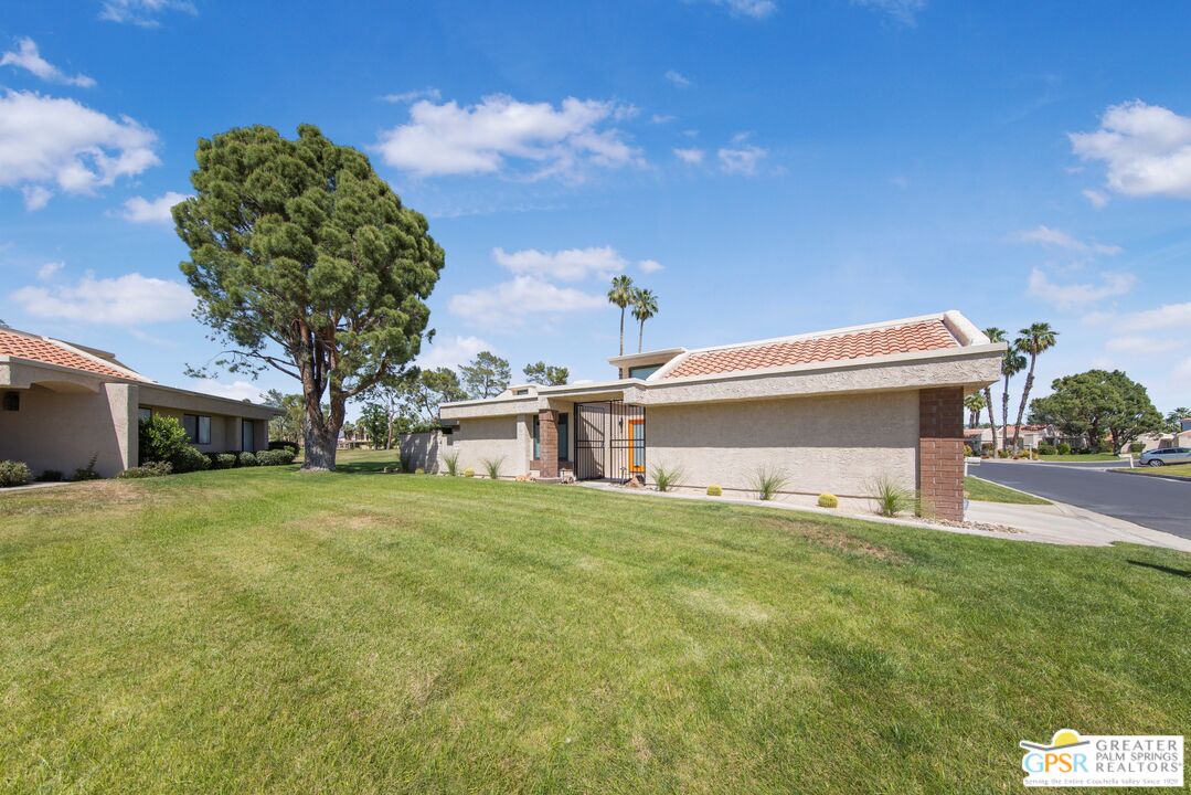 36022 Paseo Circulo West Cathedral City, CA 92234 - Photo 4 of 47 a front view of a house with a yard and garage