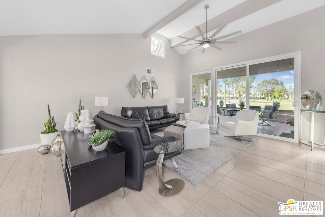 36022 Paseo Circulo West Cathedral City, CA 92234 - Photo 10 of 47 a living room with furniture and a large window