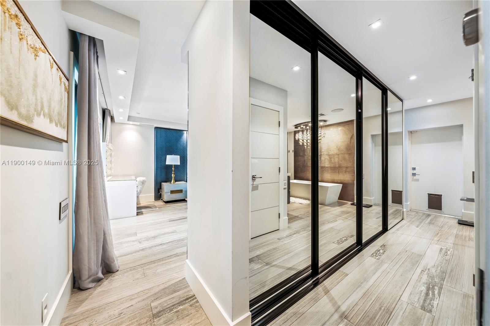 5820 Palm Tree Road Plantation, FL 33317 - Photo 11 of 23 a view of a hallway with wooden floor and glass door