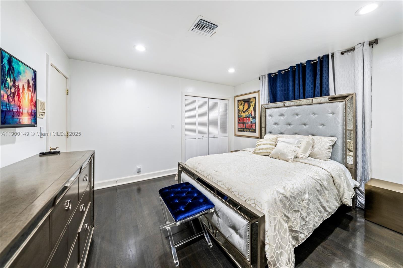 5820 Palm Tree Road Plantation, FL 33317 - Photo 13 of 23 a bedroom with a bed and a flat screen tv