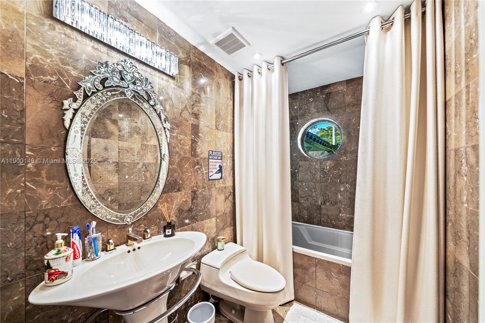 5820 Palm Tree Road Plantation, FL 33317 - Photo 14 of 23 a bathroom with a sink mirror toilet and shower