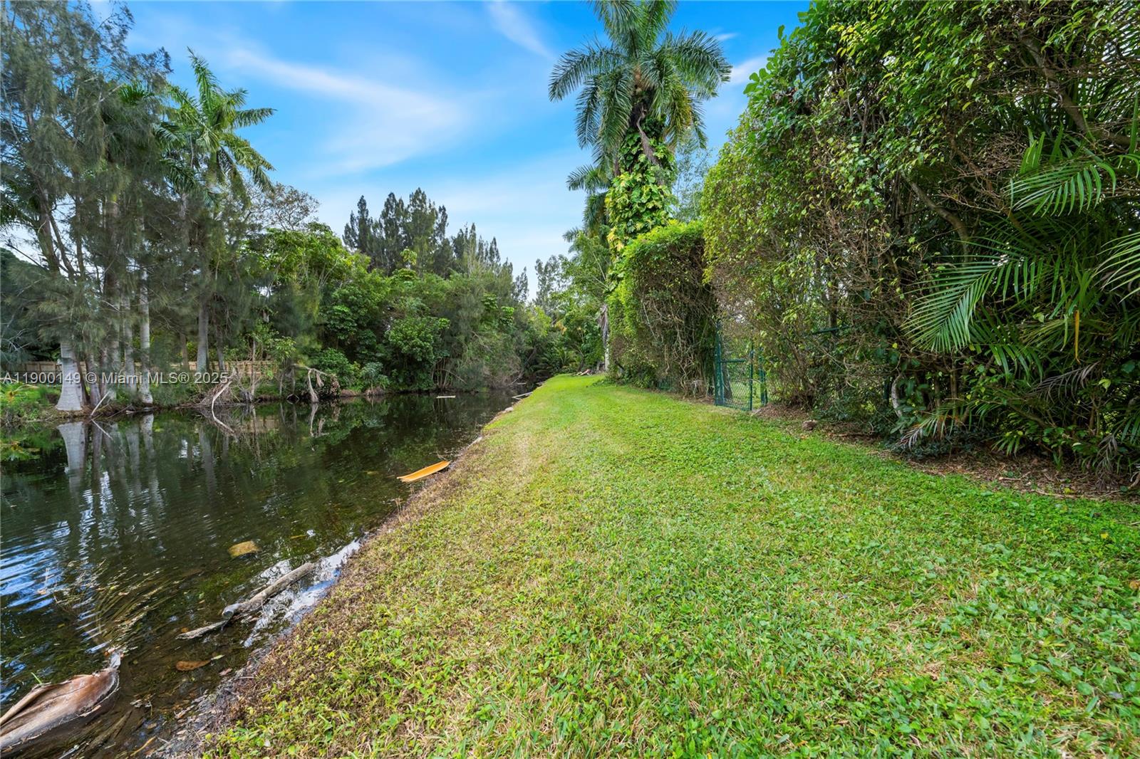 5820 Palm Tree Road Plantation, FL 33317 - Photo 20 of 23 a view of a lake with a yard