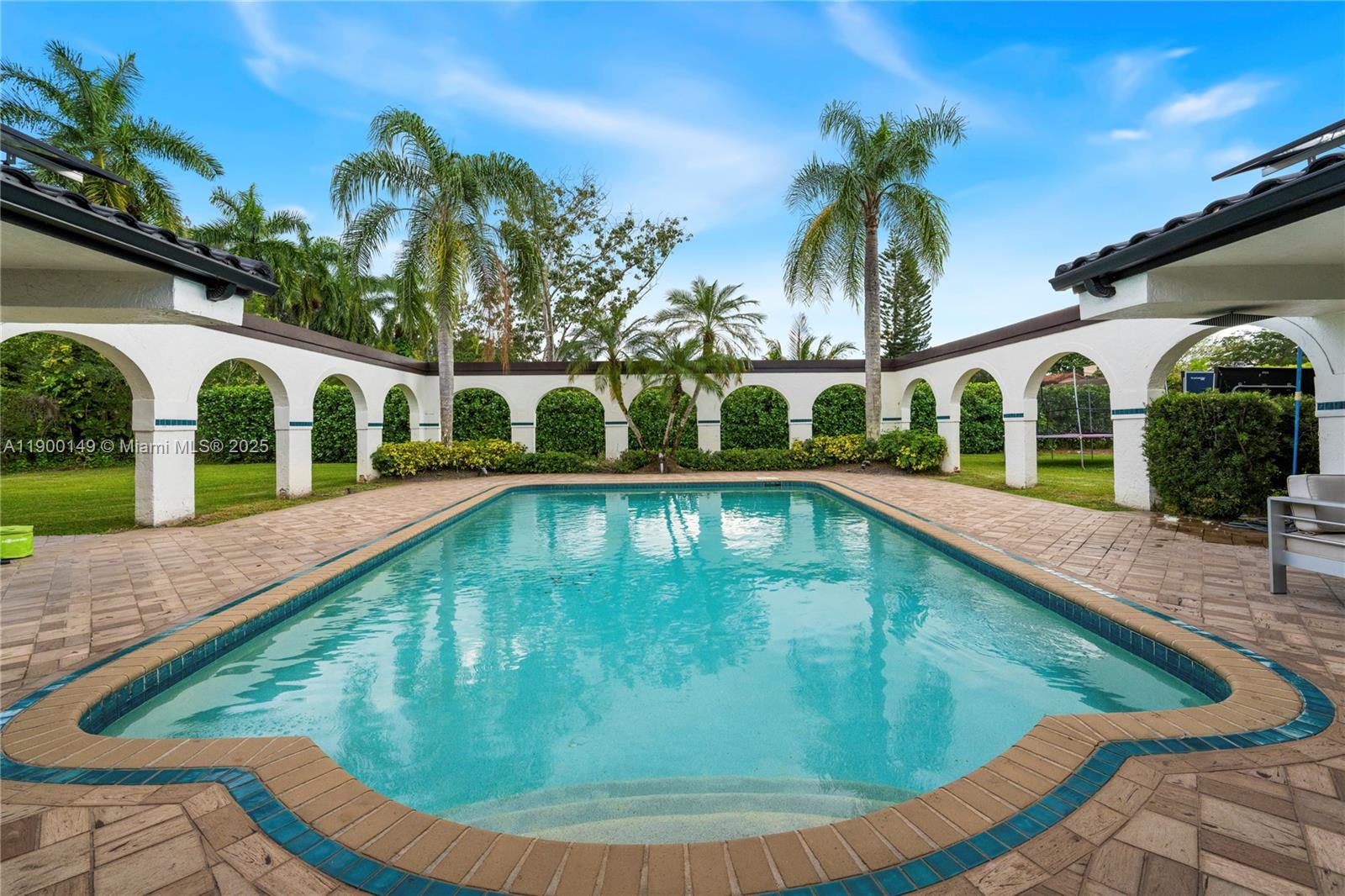 5820 Palm Tree Road Plantation, FL 33317 - Photo 22 of 23 a view of swimming pool with a garden and patio