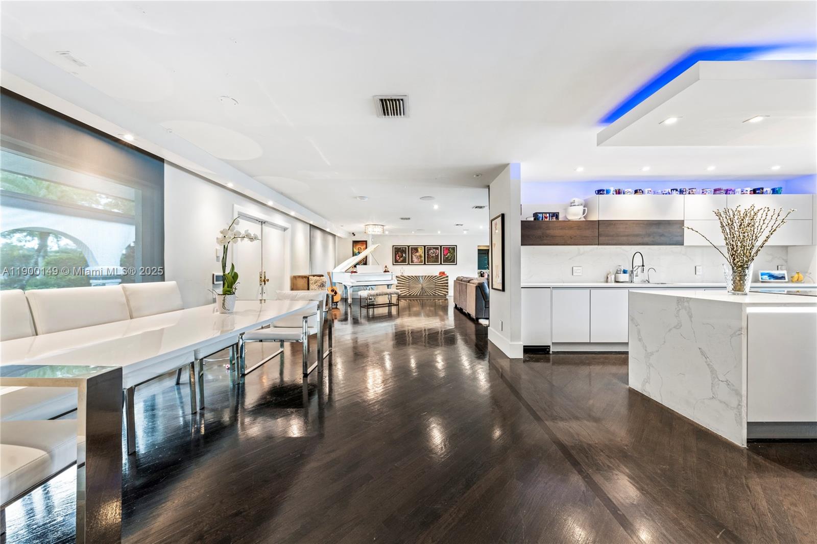 5820 Palm Tree Road Plantation, FL 33317 - Photo 8 of 23 a kitchen with stainless steel appliances lots of counter top space and wooden floor